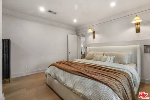 a bedroom with furniture and windows