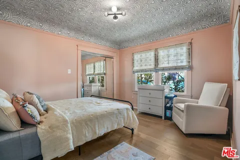 a bedroom with a bed and a couch