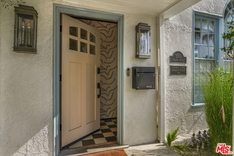 a front view of a house with a glass door