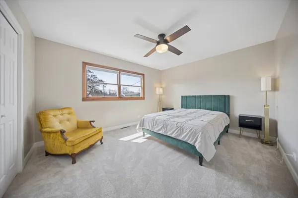 a bedroom with a bed and a couch