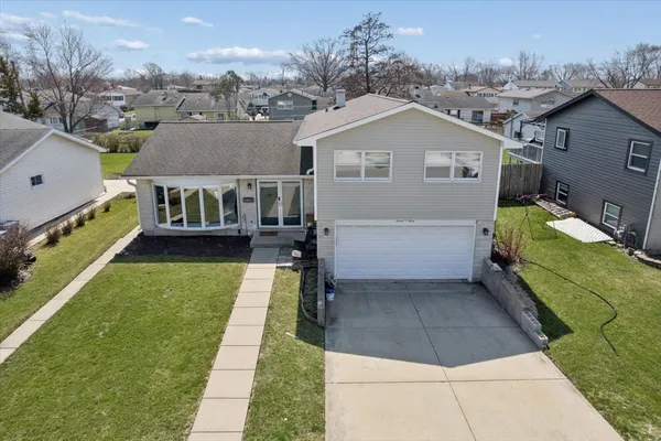 a aerial view of a house with a yard