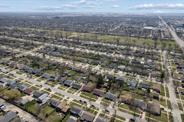 an aerial view of residential building with parking space