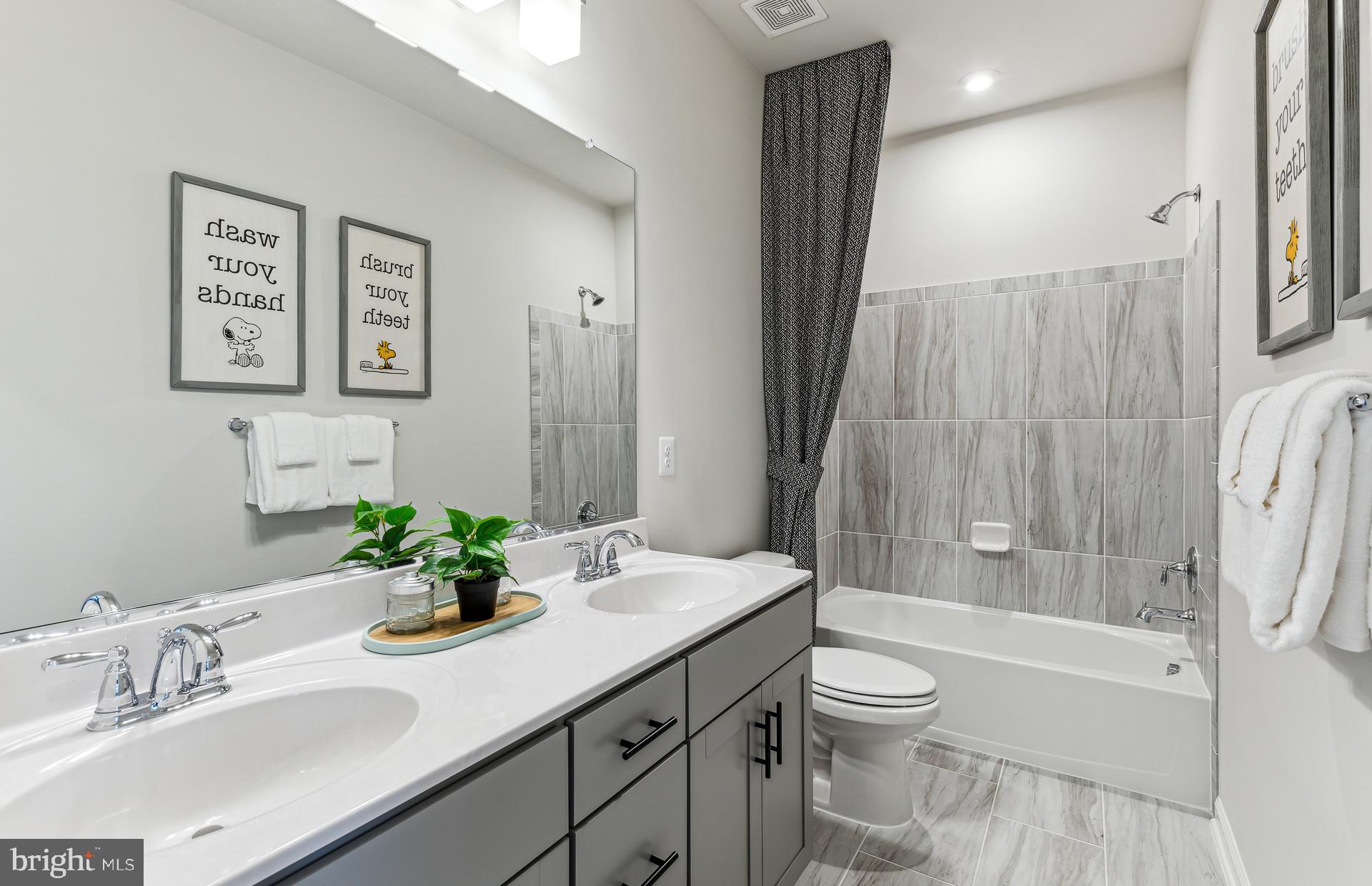 42851 Robins Perch Terrace Leesburg, VA 20176 - Photo 9 of 38 a bathroom with a granite countertop sink toilet and shower