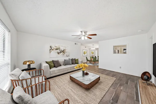 a living room with furniture and a rug