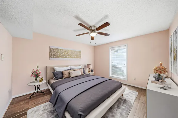 a bedroom with a bed and a window