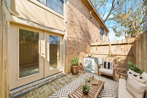 a view of a chairs and table in a balcony