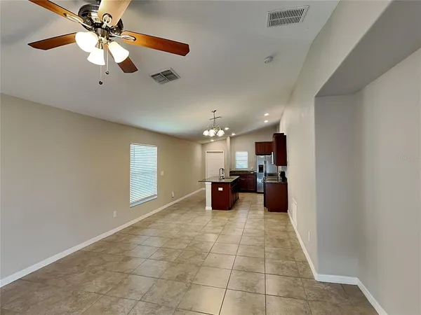 a large room with chandelier fan