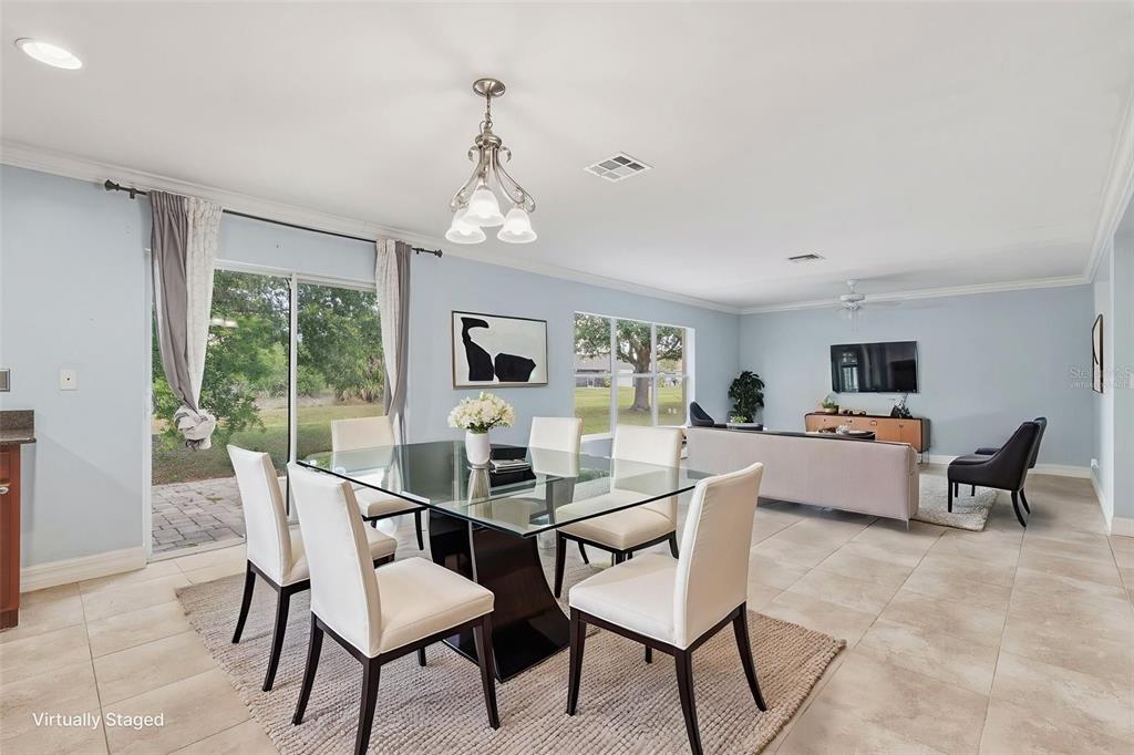 25134 Palisade Road Punta Gorda, FL 33983 - Photo 19 of 58 a view of a dining room with furniture window and outside view
