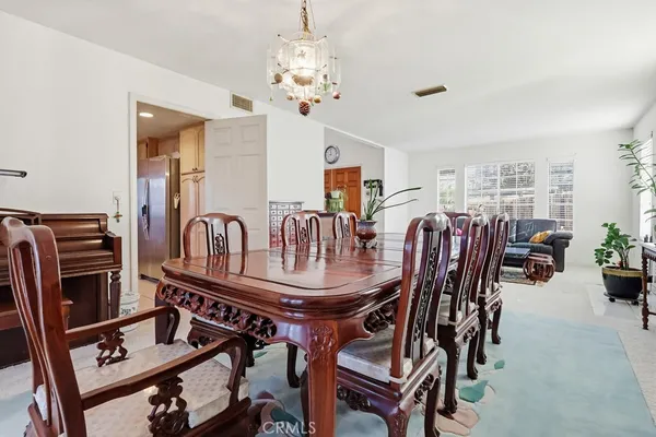 a kitchen with a stove a sink and a refrigerator