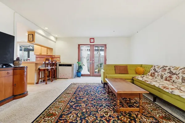 a kitchen with appliances cabinets and utility room