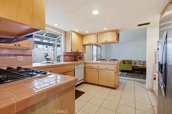 a view of a hallway with wooden floor and entryway