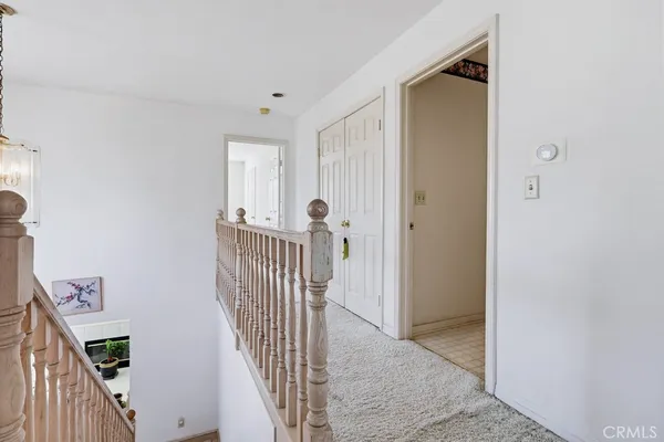 a bedroom with a bed and a desk