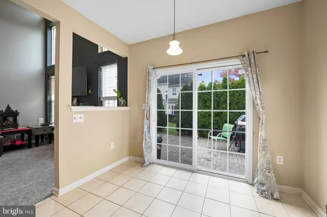 a kitchen with a refrigerator sink and cabinets