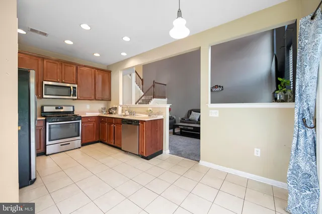 a room with window and chandelier