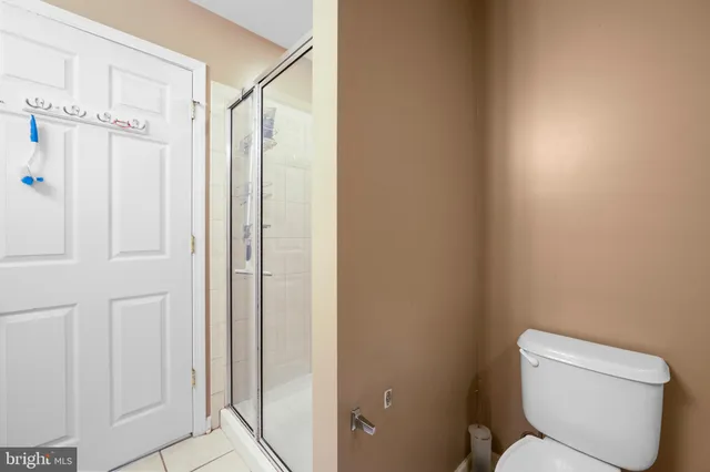 a bedroom with a bed and a dresser in it