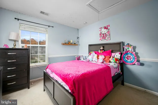 a bed room with a bed and a window