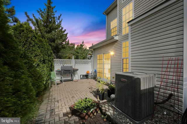 a view of backyard with outdoor seating