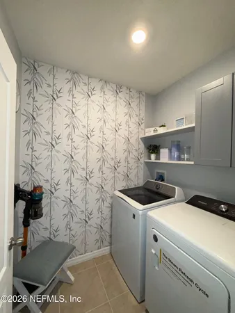 a bathroom with a sink and a washing machine