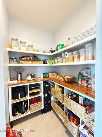 a shelf with books and knick knacks on it