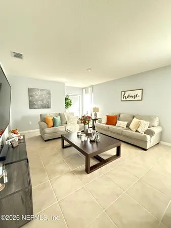 a living room with furniture and a couch