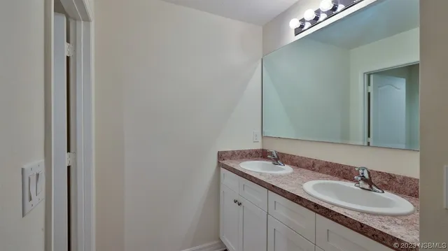 an aerial view of a house with a garden