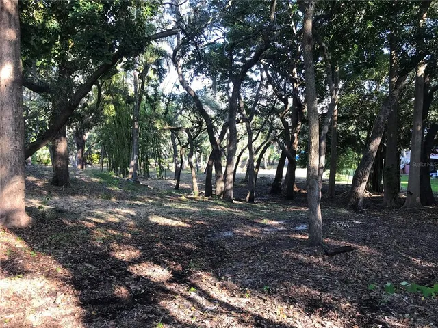 swimming pool view with a lake view