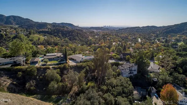 an aerial view of residential house and green space