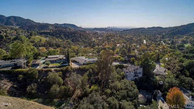 an aerial view of residential house and green space