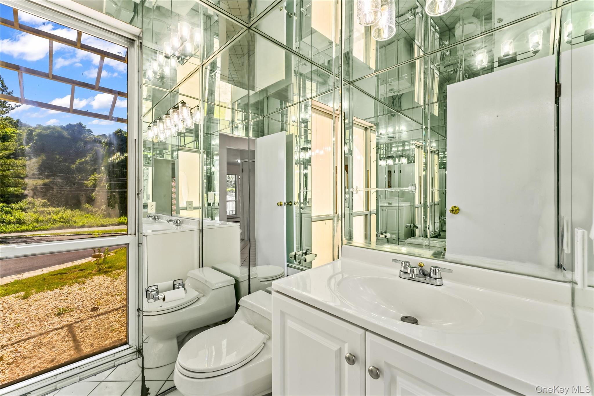 126 Bagatelle Road Melville, NY 11747 - Photo 16 of 50 a bathroom with a sink toilet and shower