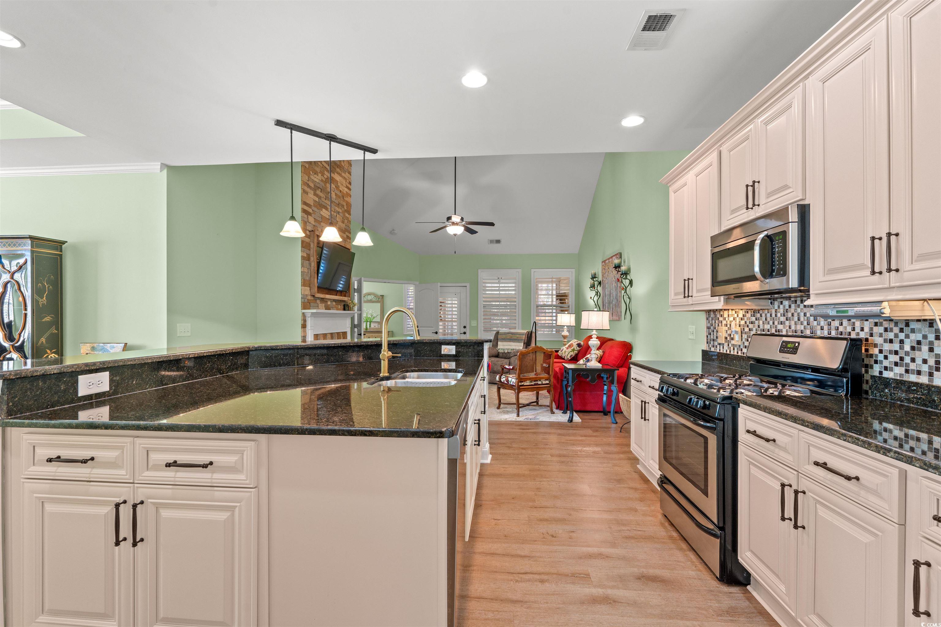 570 Botany Loop, Unit 570 Murrells Inlet, SC 29576 - Photo 12 of 36 Kitchen featuring visible vents, a ceiling fan, tasteful backsplash, appliances with stainless steel finishes, and a sink