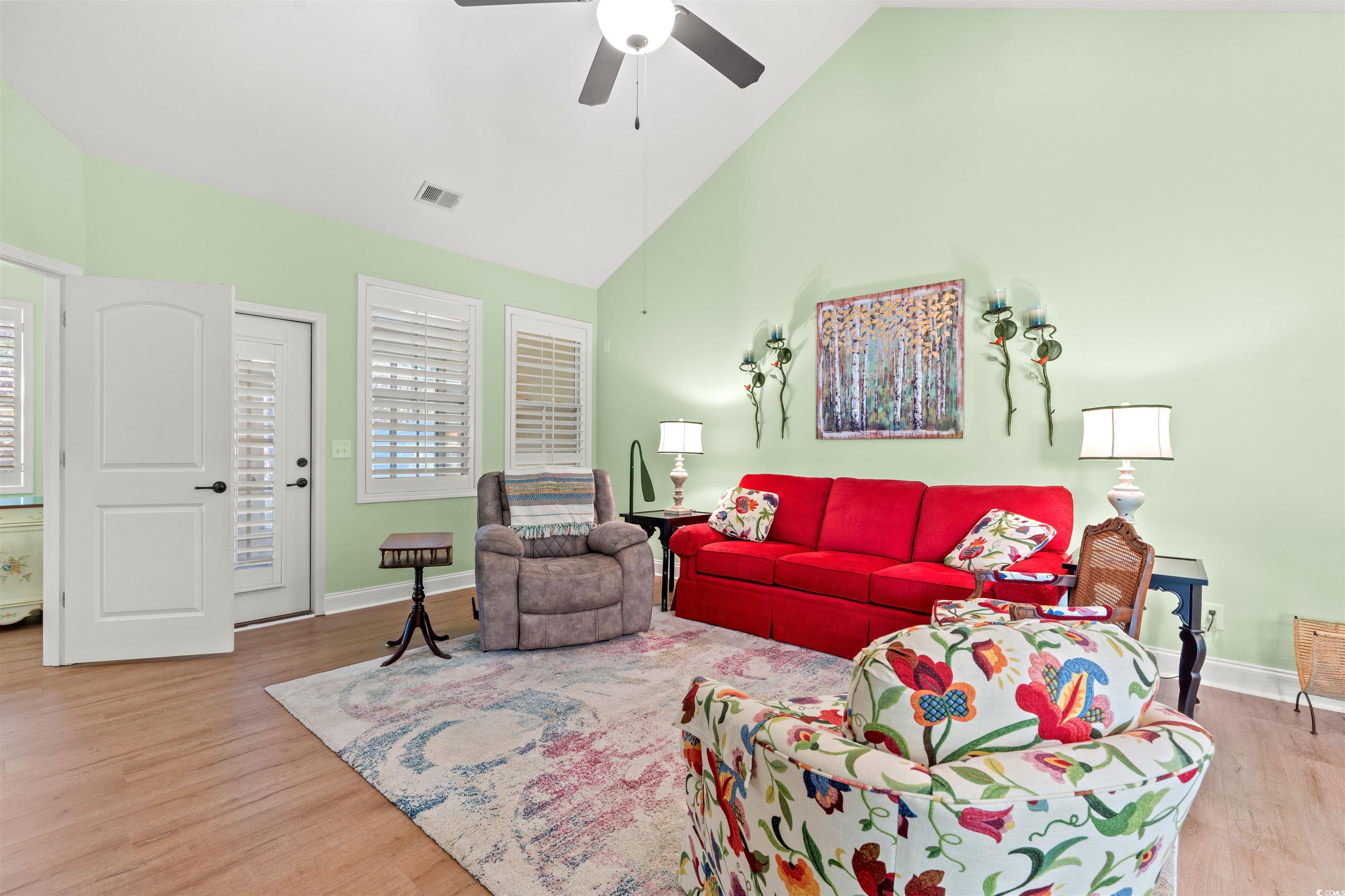 570 Botany Loop, Unit 570 Murrells Inlet, SC 29576 - Photo 14 of 36 Living room with baseboards, visible vents, wood finished floors, and a ceiling fan