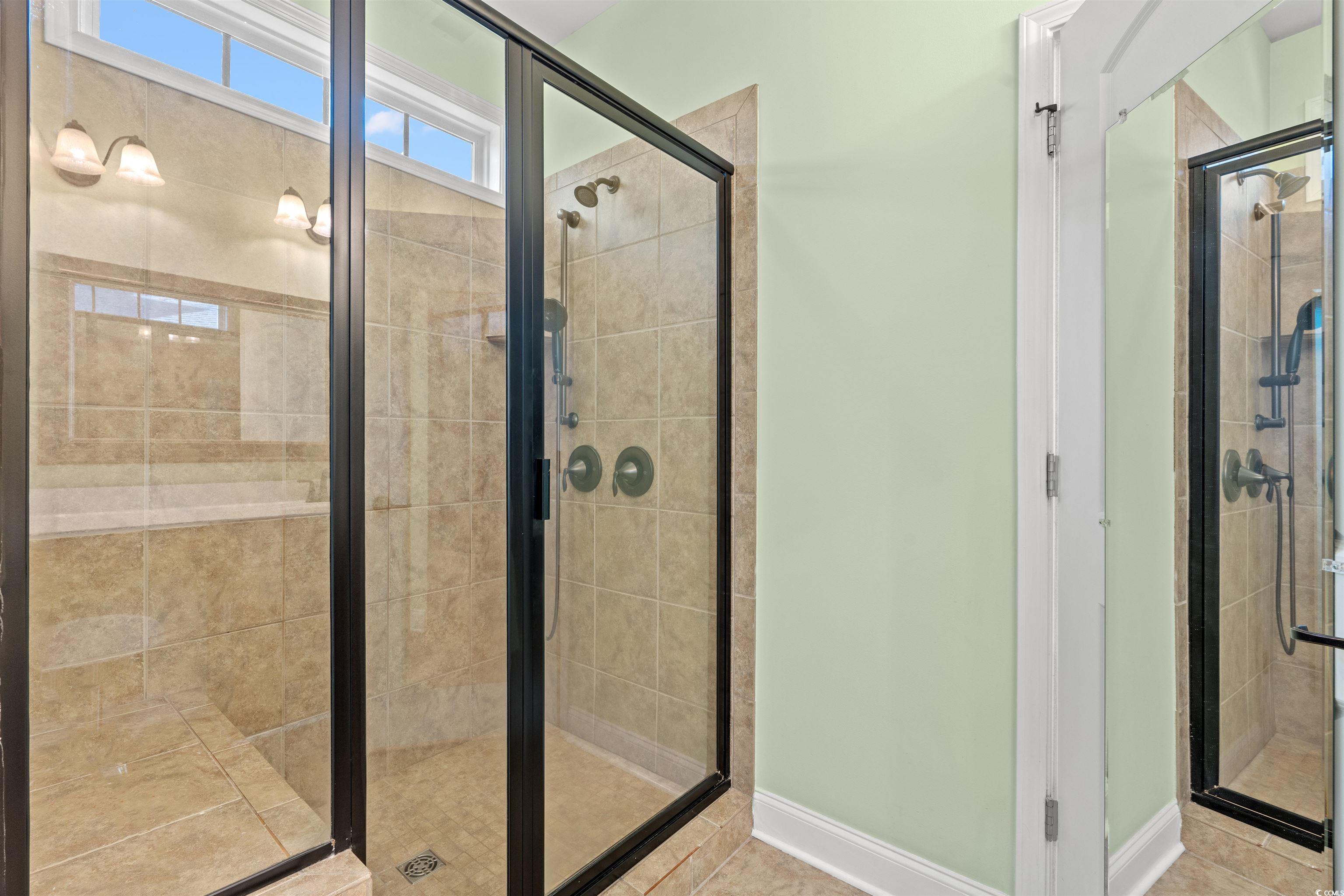 570 Botany Loop, Unit 570 Murrells Inlet, SC 29576 - Photo 22 of 36 Full bathroom featuring a stall shower, baseboards, and tile patterned flooring