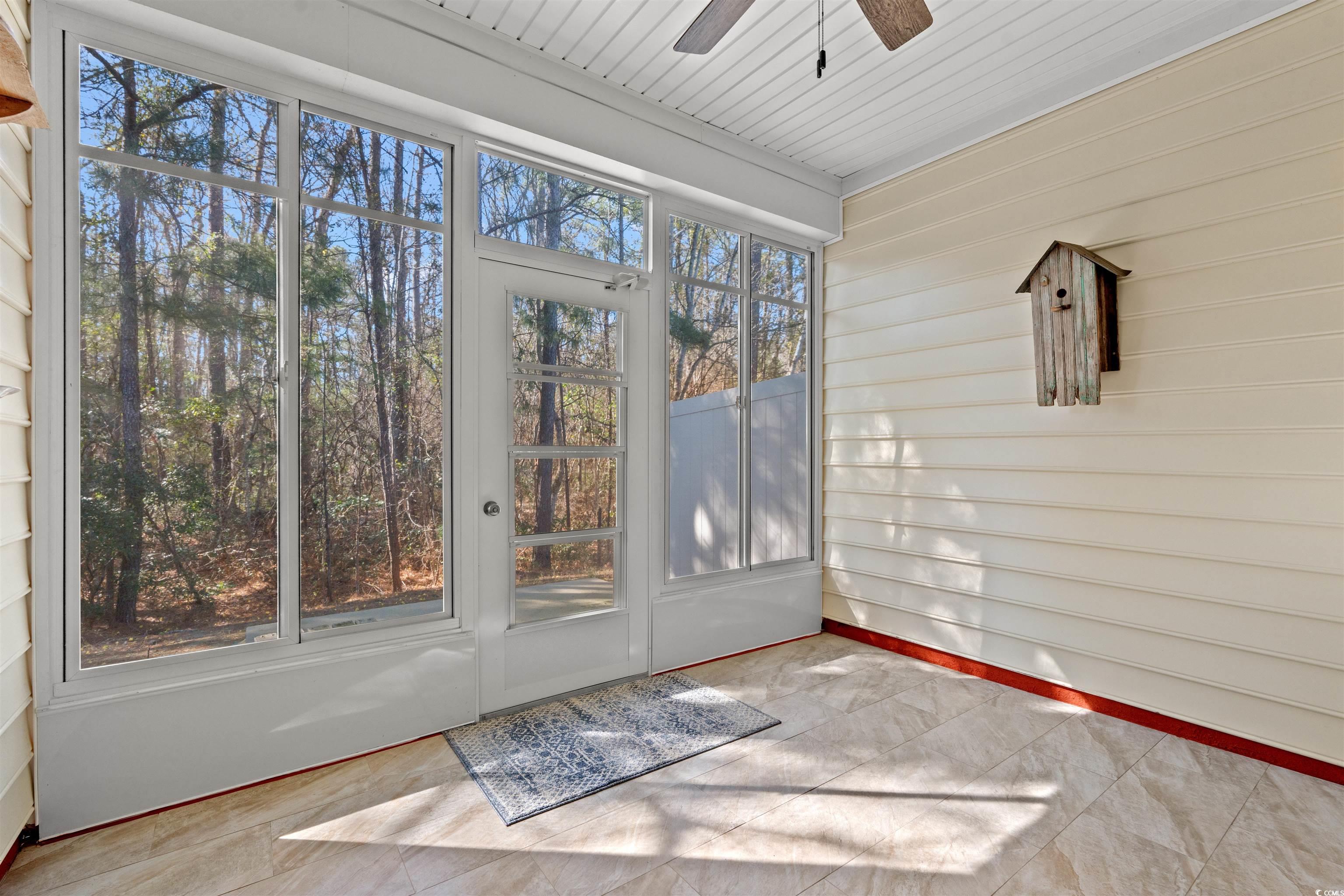 570 Botany Loop, Unit 570 Murrells Inlet, SC 29576 - Photo 23 of 36 Unfurnished sunroom featuring a ceiling fan