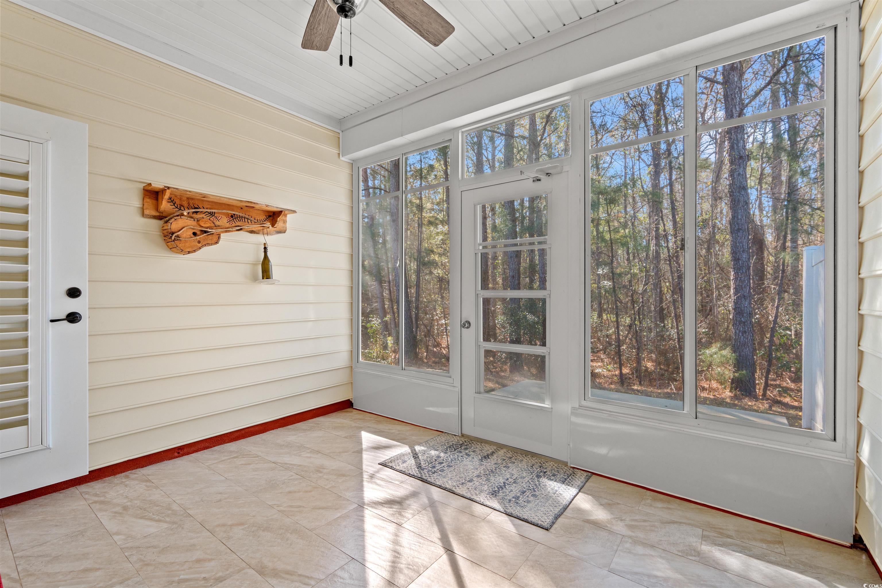 570 Botany Loop, Unit 570 Murrells Inlet, SC 29576 - Photo 24 of 36 Unfurnished sunroom featuring ceiling fan