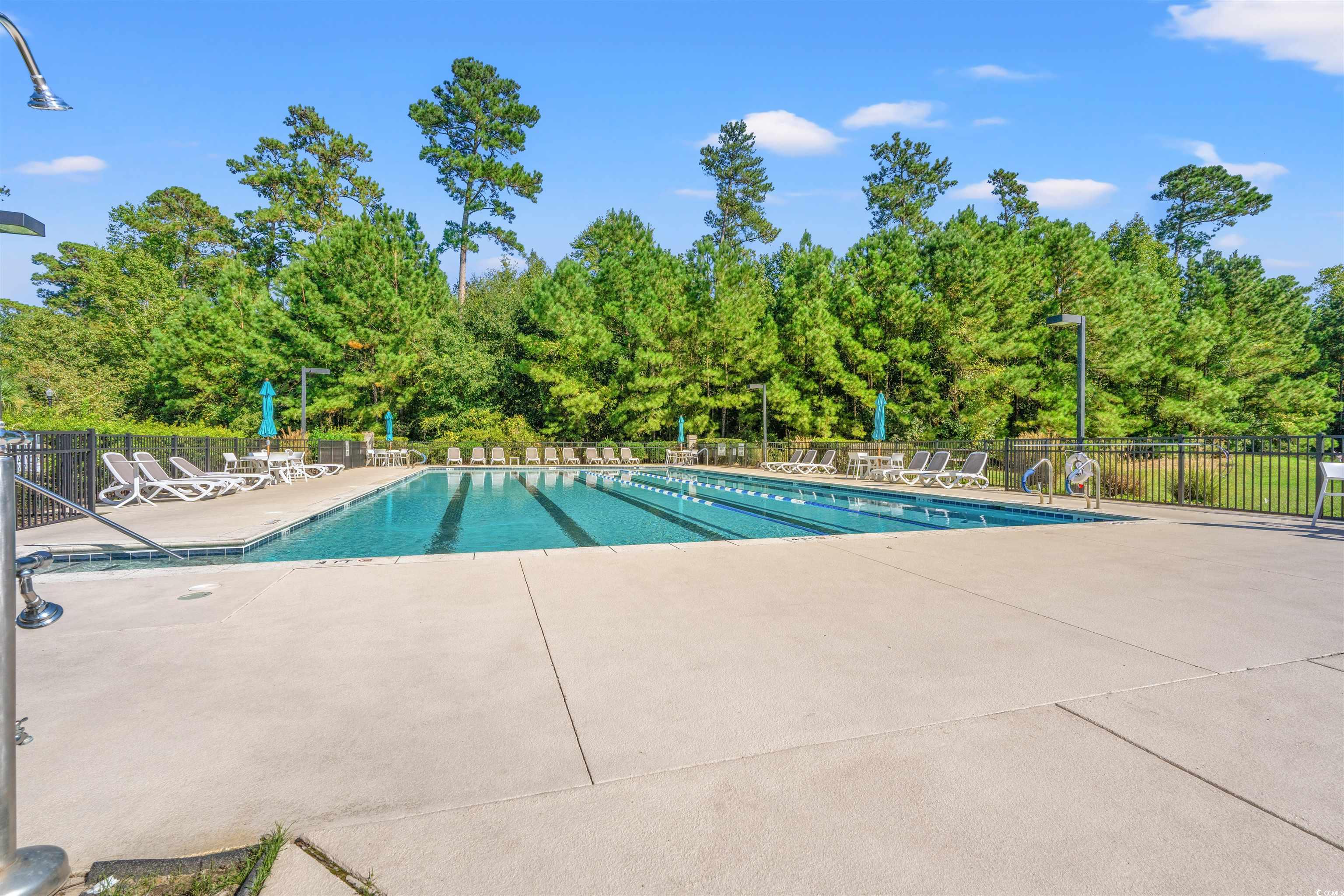 570 Botany Loop, Unit 570 Murrells Inlet, SC 29576 - Photo 28 of 36 Community pool featuring fence and a patio area