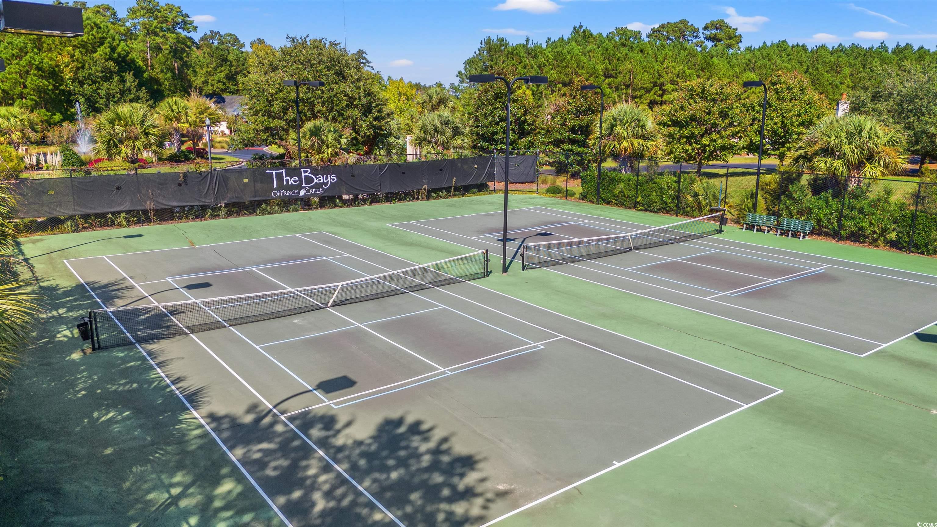 570 Botany Loop, Unit 570 Murrells Inlet, SC 29576 - Photo 30 of 36 View of tennis court featuring community basketball court and fence