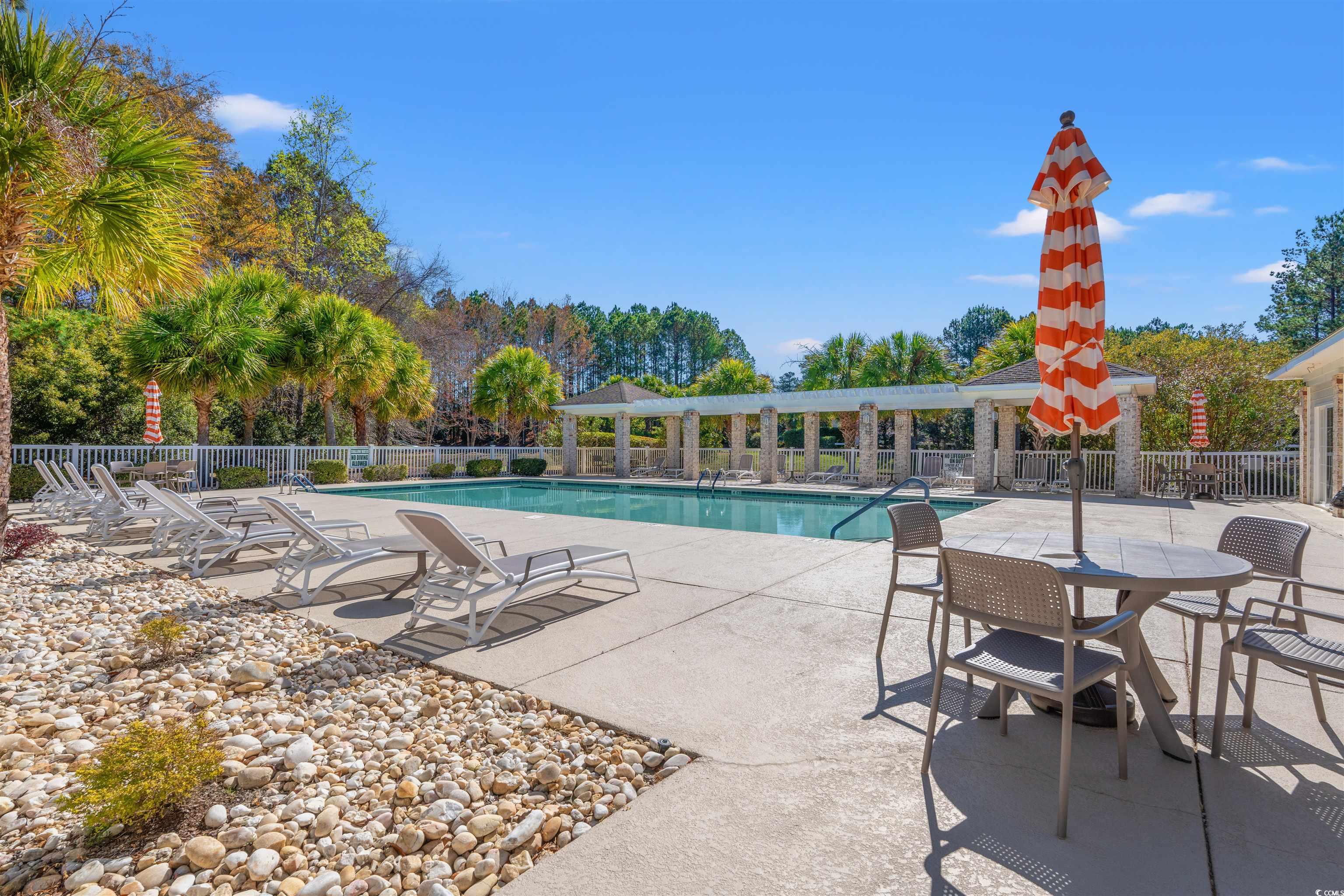 570 Botany Loop, Unit 570 Murrells Inlet, SC 29576 - Photo 33 of 36 Community pool with a patio and fence
