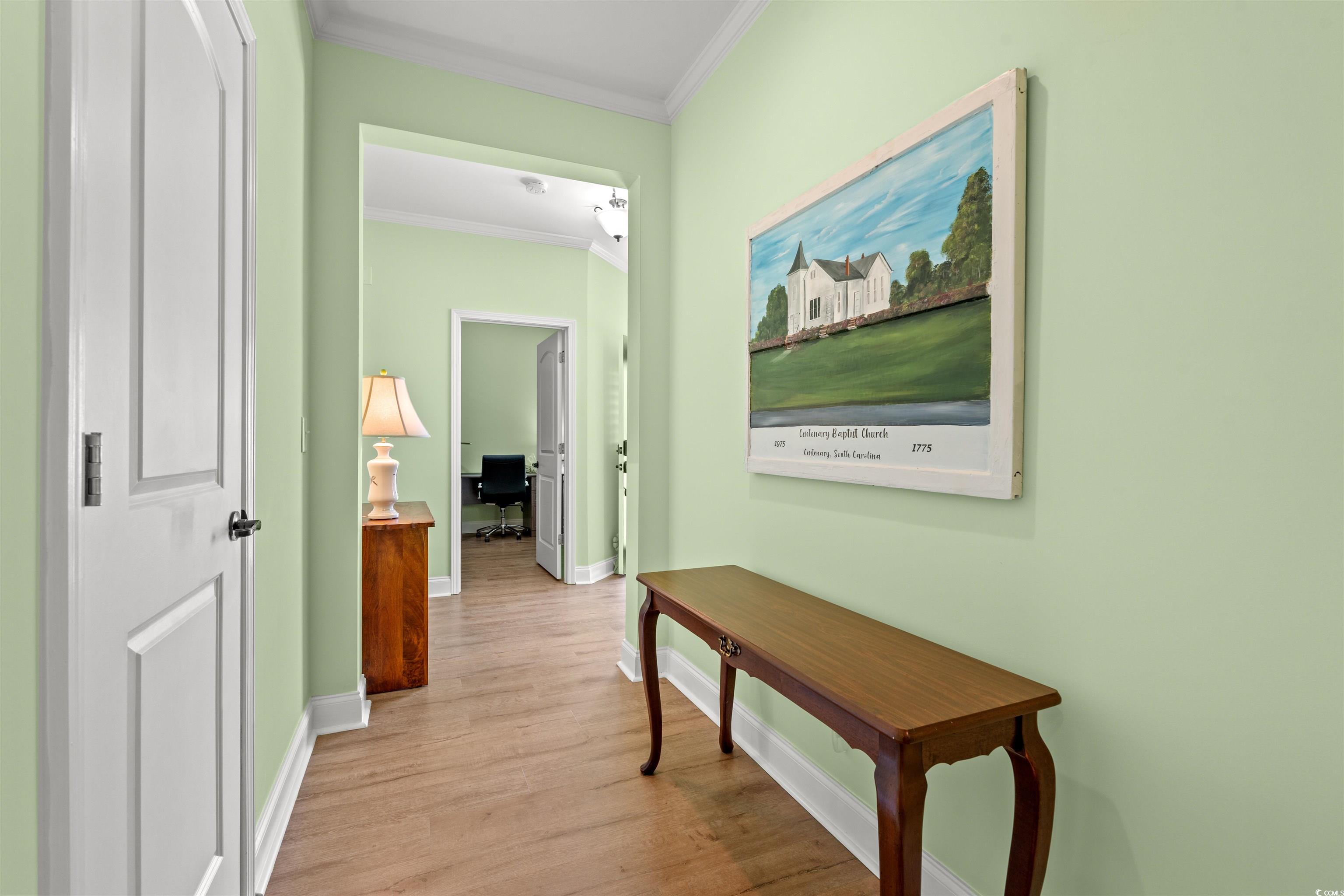 570 Botany Loop, Unit 570 Murrells Inlet, SC 29576 - Photo 4 of 36 Corridor featuring ornamental molding, baseboards, and wood finished floors
