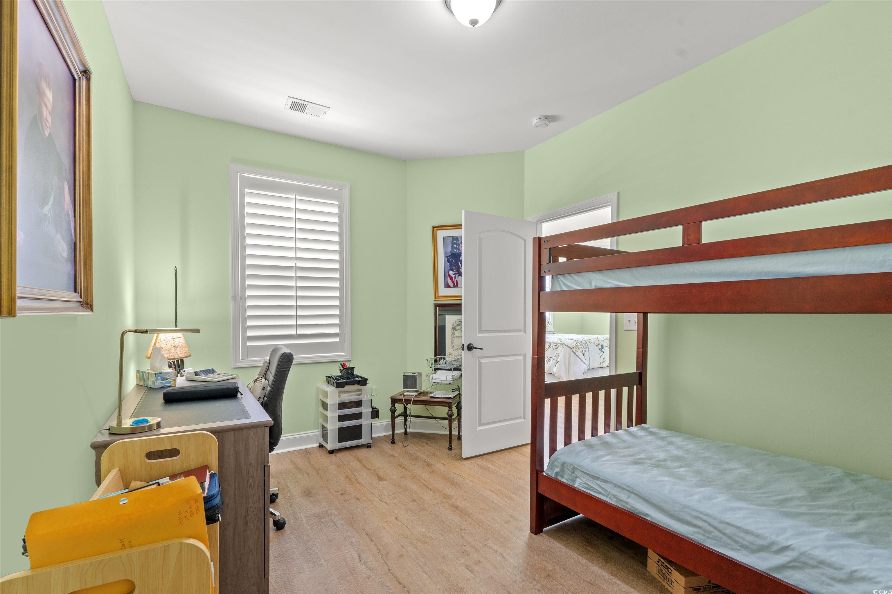 570 Botany Loop, Unit 570 Murrells Inlet, SC 29576 - Photo 6 of 36 Bedroom with baseboards, visible vents, multiple windows, and light wood-type flooring