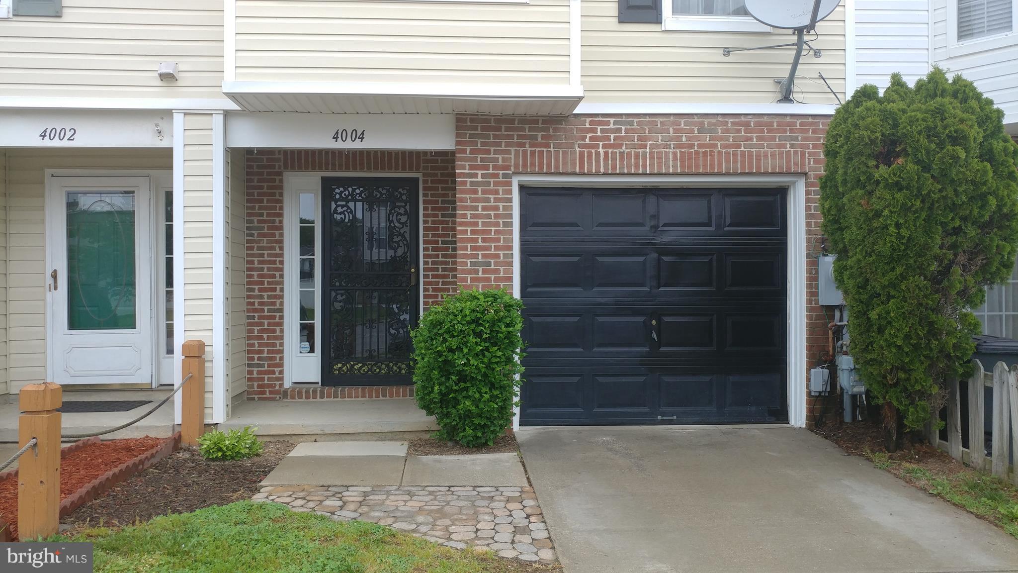4004 Cutty Sark Road Baltimore, MD 21220 - Photo 3 of 30 Front view with an NEW GARAGE DOOR