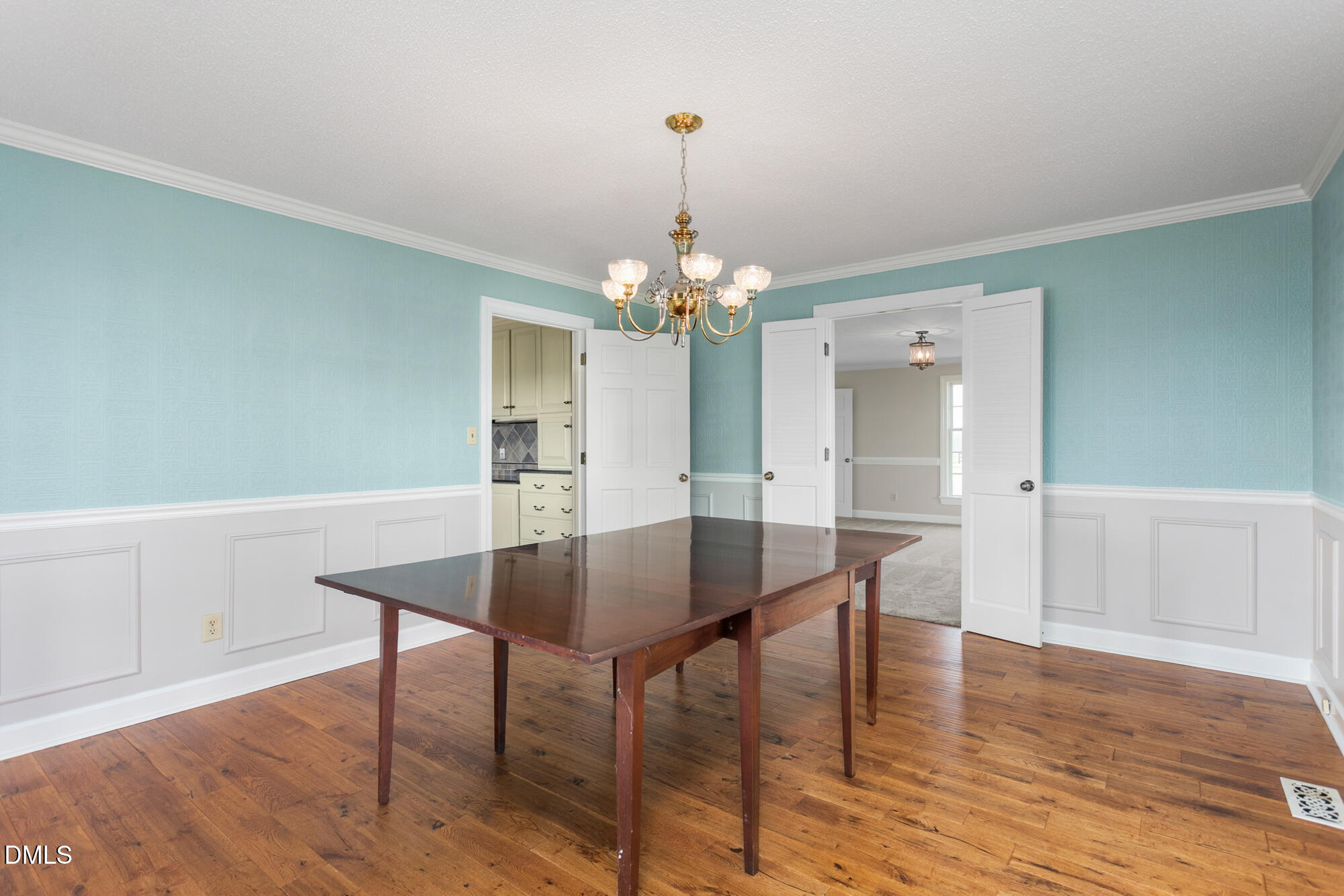 7201 Efland - Cedar Grove Road Cedar Grove, NC 27231 - Photo 11 of 70 a view of a dining room with furniture and wooden floor