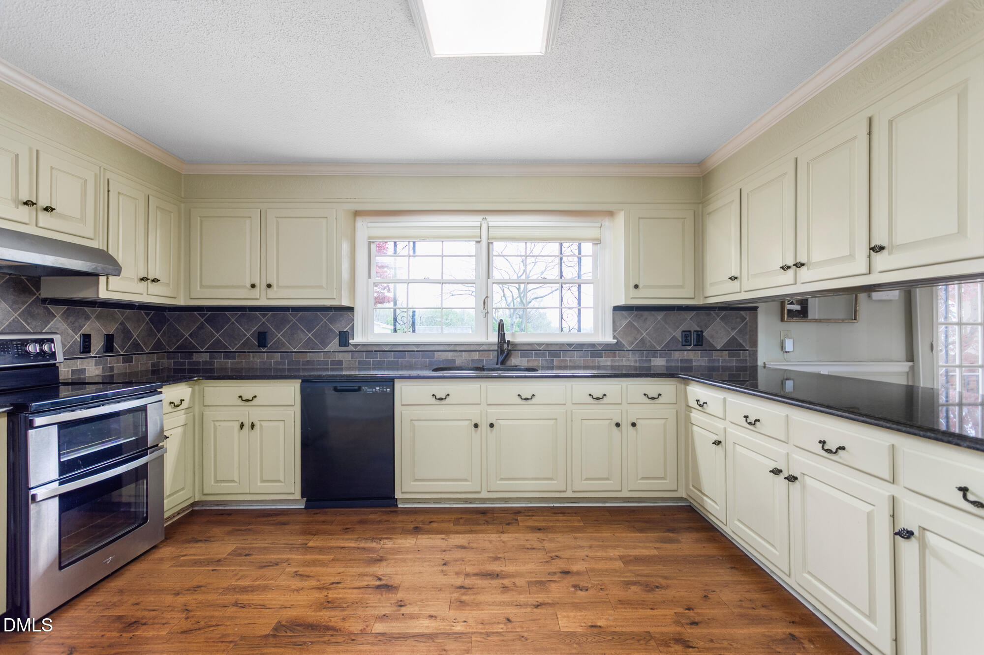 7201 Efland - Cedar Grove Road Cedar Grove, NC 27231 - Photo 13 of 70 a kitchen with granite countertop white cabinets white stainless steel appliances with a sink and dishwasher