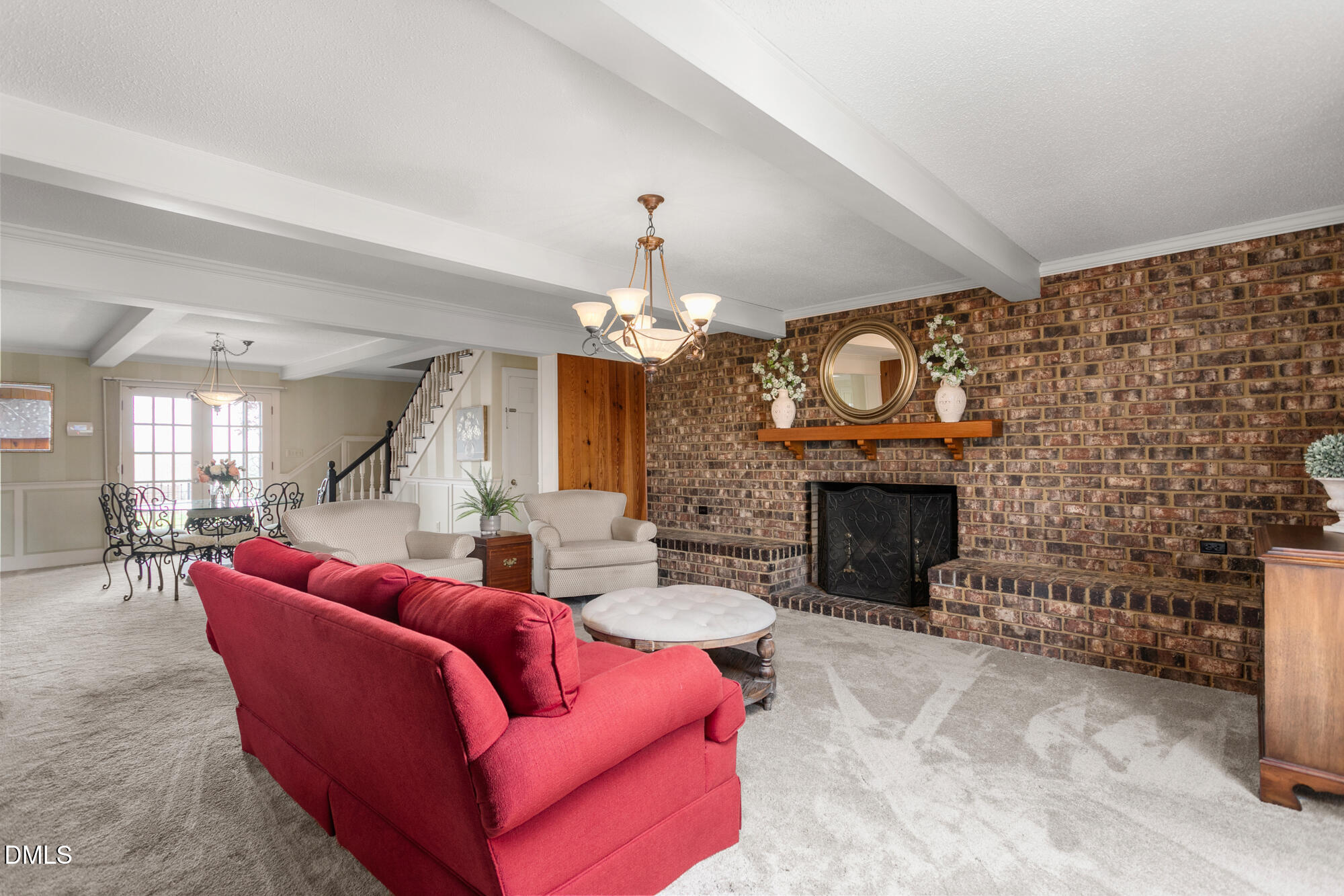 7201 Efland - Cedar Grove Road Cedar Grove, NC 27231 - Photo 18 of 70 a living room with furniture a fireplace and a chandelier