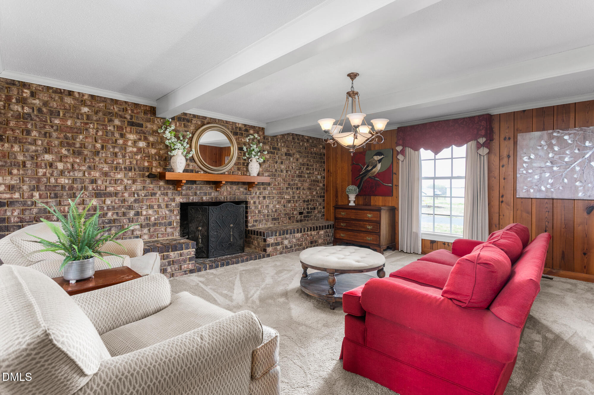 7201 Efland - Cedar Grove Road Cedar Grove, NC 27231 - Photo 20 of 70 a living room with furniture a fireplace and a chandelier