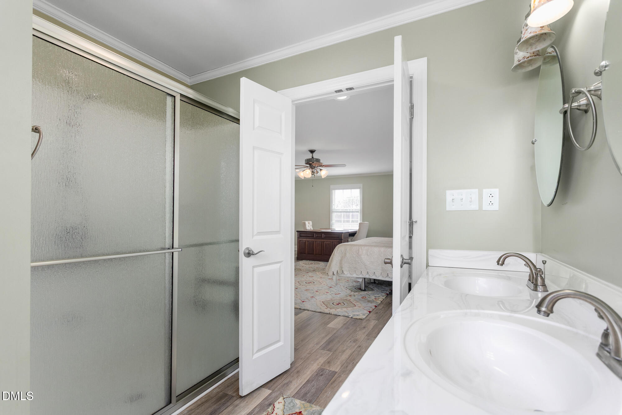 7201 Efland - Cedar Grove Road Cedar Grove, NC 27231 - Photo 27 of 70 a en suite bathroom with a sink shower and a mirror
