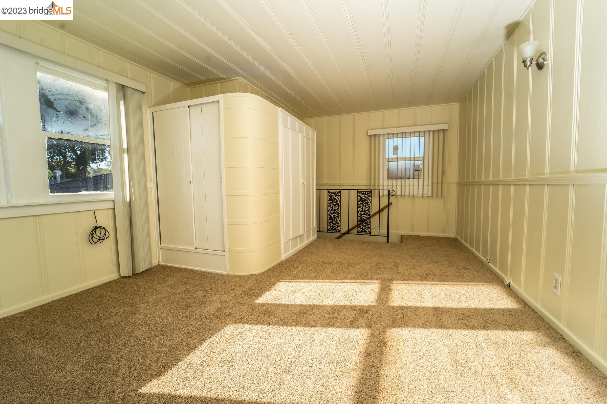 2205 Curtis Street Berkeley, CA 94702 - Photo 22 of 38 a view of a hallway with windows