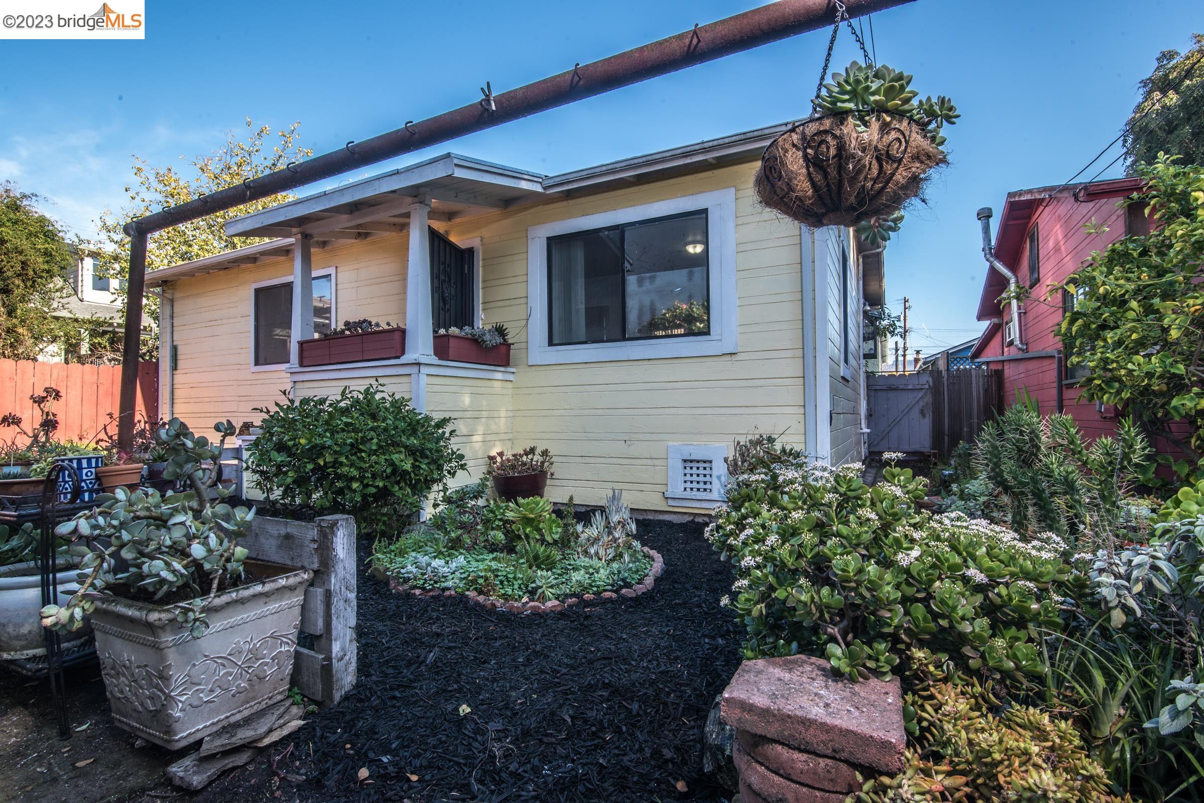 2205 Curtis Street Berkeley, CA 94702 - Photo 3 of 38 a front view of a house with a yard