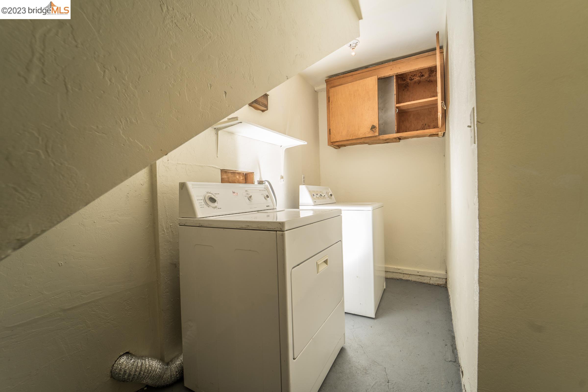 2205 Curtis Street Berkeley, CA 94702 - Photo 33 of 38 a utility room with dryer and washer