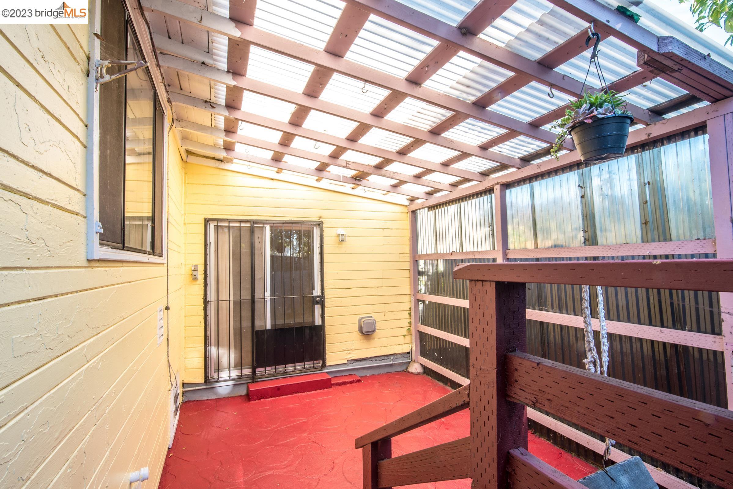 2205 Curtis Street Berkeley, CA 94702 - Photo 36 of 38 a view of a porch with furniture and a gate