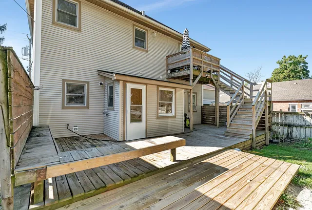 a view of a house with a large window and wooden floor